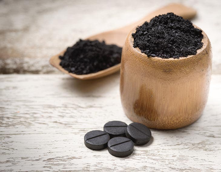 Polvo y tabletas de carbón activado