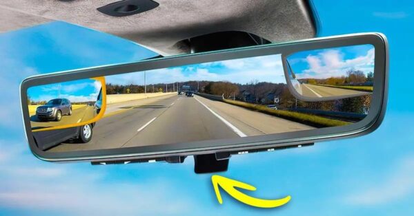 ¿Cuál es la función de la palanca debajo del espejo interior?